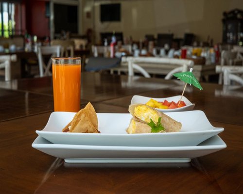 Fresh fruits and Mexican breakfast dishes on a table
